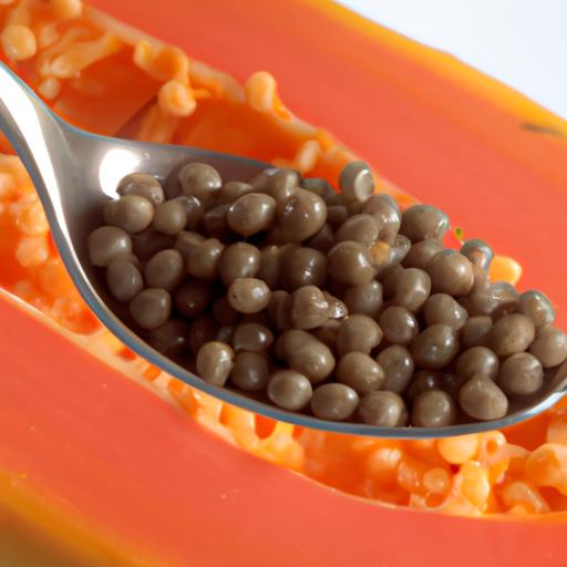 Close-up of papaya seeds in a spoon