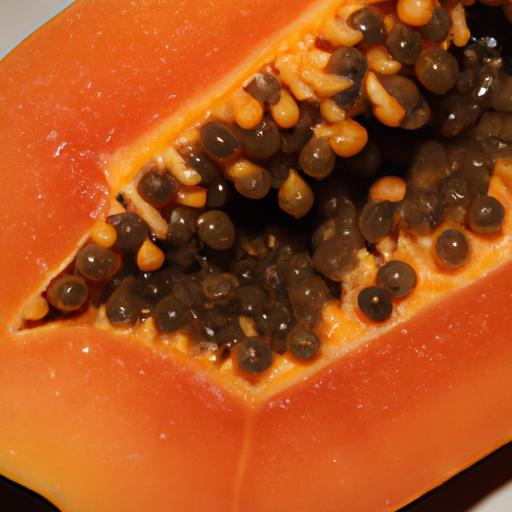 The distinct aroma of papaya emanating from a freshly sliced fruit.