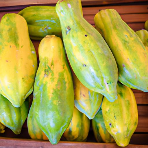 Freshly picked papayas for sale at a local farmers' market.