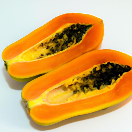 A close-up of sliced papaya on a white plate