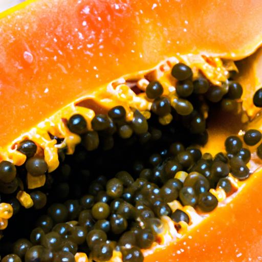 A ripe papaya with its vibrant orange flesh and black seeds.