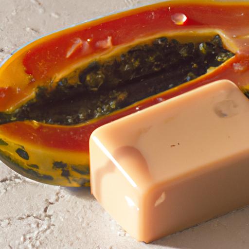 A ripe papaya fruit and a bar of papaya soap - the key components of papaya soap.
