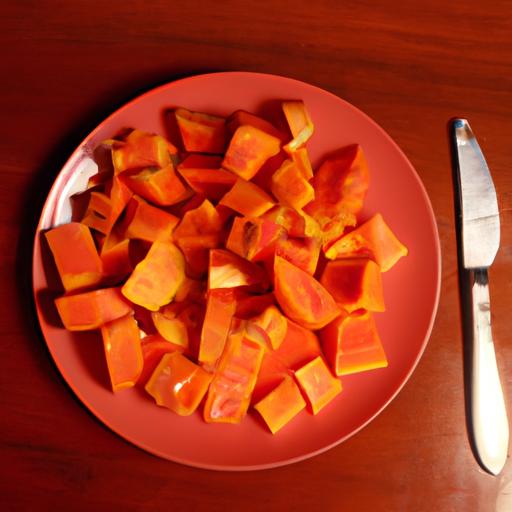 A plate of ripe papaya slices ready to be enjoyed.