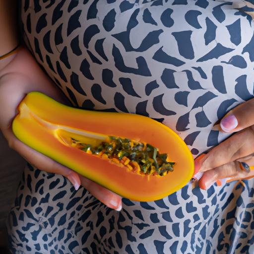A pregnant woman holding a ripe papaya, contemplating its potential effects on her pregnancy.