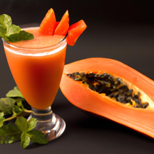 Refreshing papaya juice served in a glass with a slice of papaya and mint leaves as garnish.