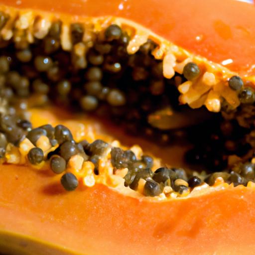 Ripe papaya fruit with vibrant orange flesh and black seeds.