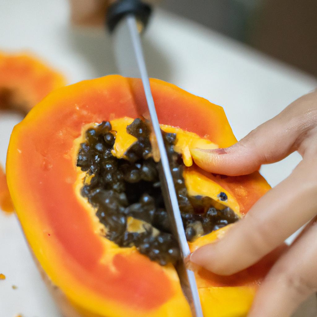 Testing the taste of a ripe papaya by sampling its flesh