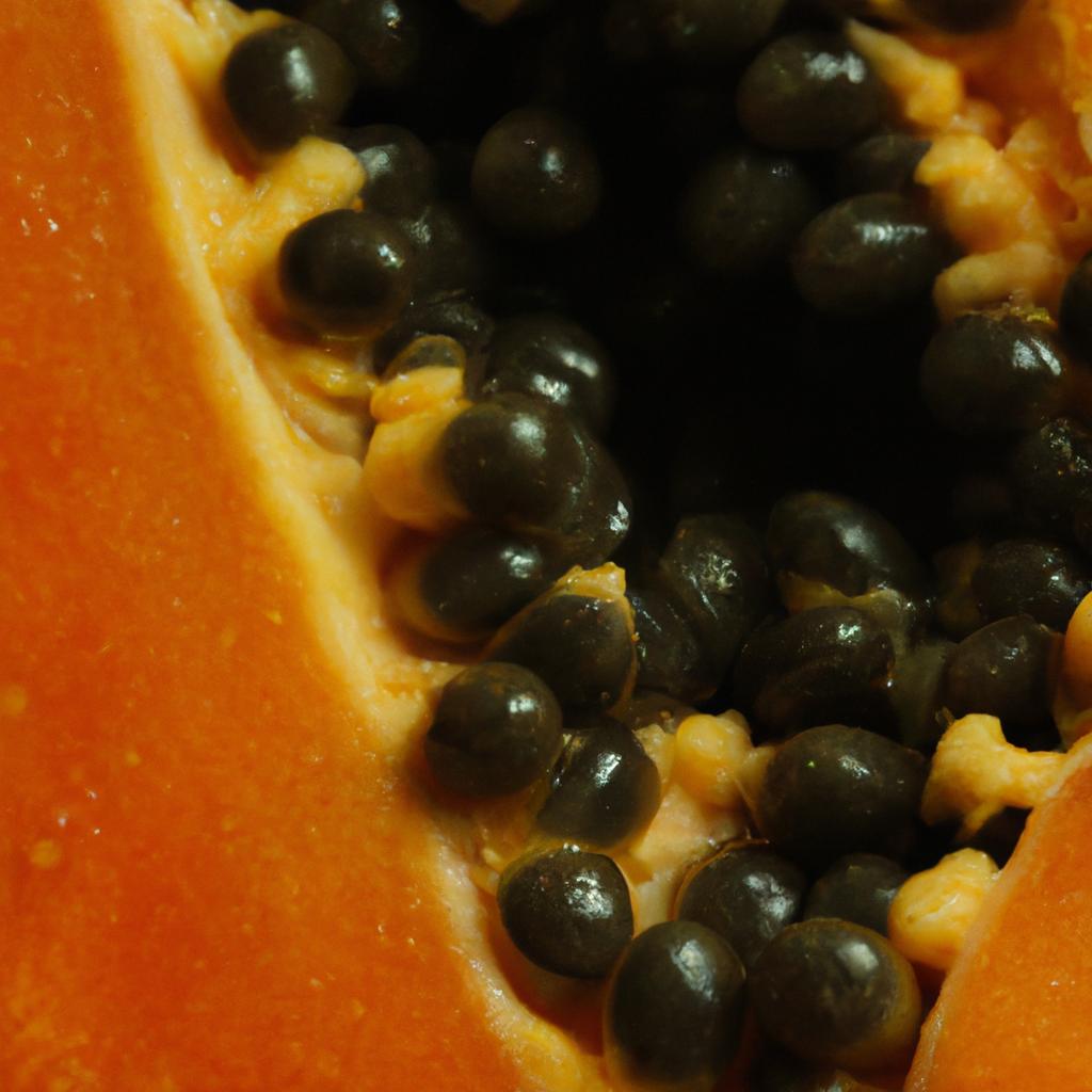The inner beauty of a halved papaya, showcasing its abundant seeds.