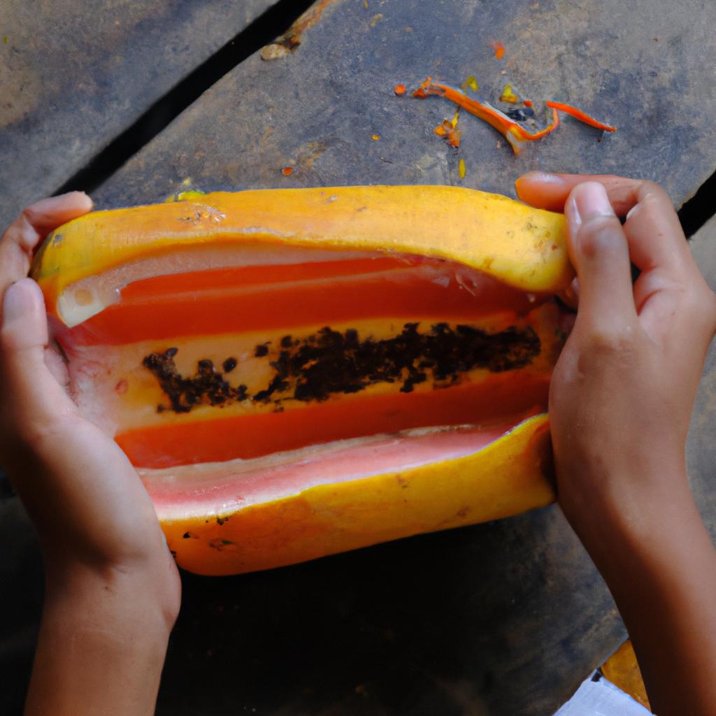 Peeling a ripe papaya